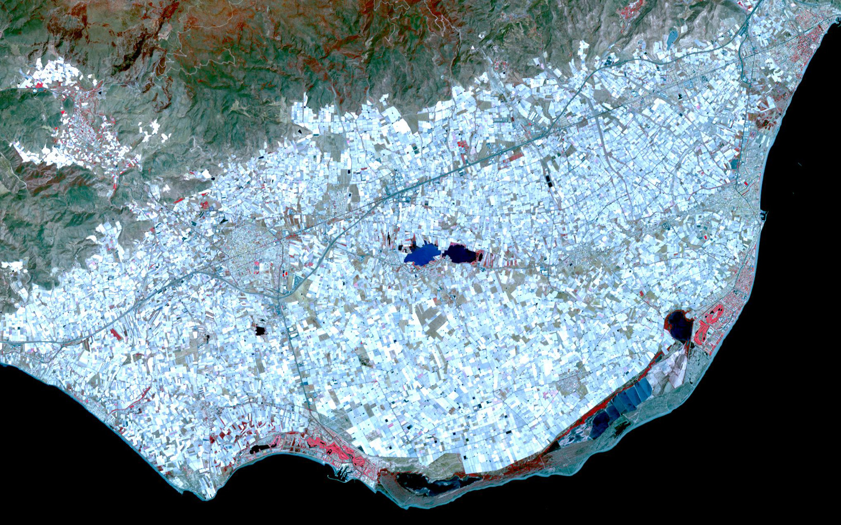 Image: NASA/GSFC/METI/ERSDAC/JAROS, and U.S./Japan ASTER Science Team, Surrounding the town of El Ejido, Almeria Province, southern Spain is a sea of greenhouses, stretching for tens of kilometres.
