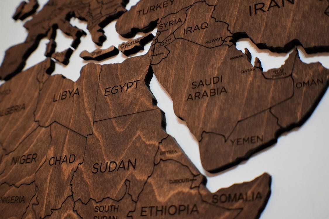 Sudan shown on a wooden map of north-west Africa and the Mediterranean region.