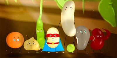 A group of beans stand together in a field, including a lentil, a chickpea, a pea pod and a bean superhero wearing a cape.