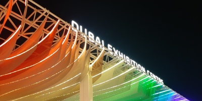 A photo of the Dubai Exhibition Centre lit up at night. Photo by Ruth Mattock.