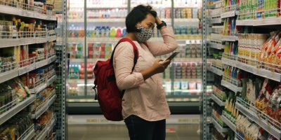 Photo of a woman shopping in a grocery store. Image by Viki Mohamad via Unsplash