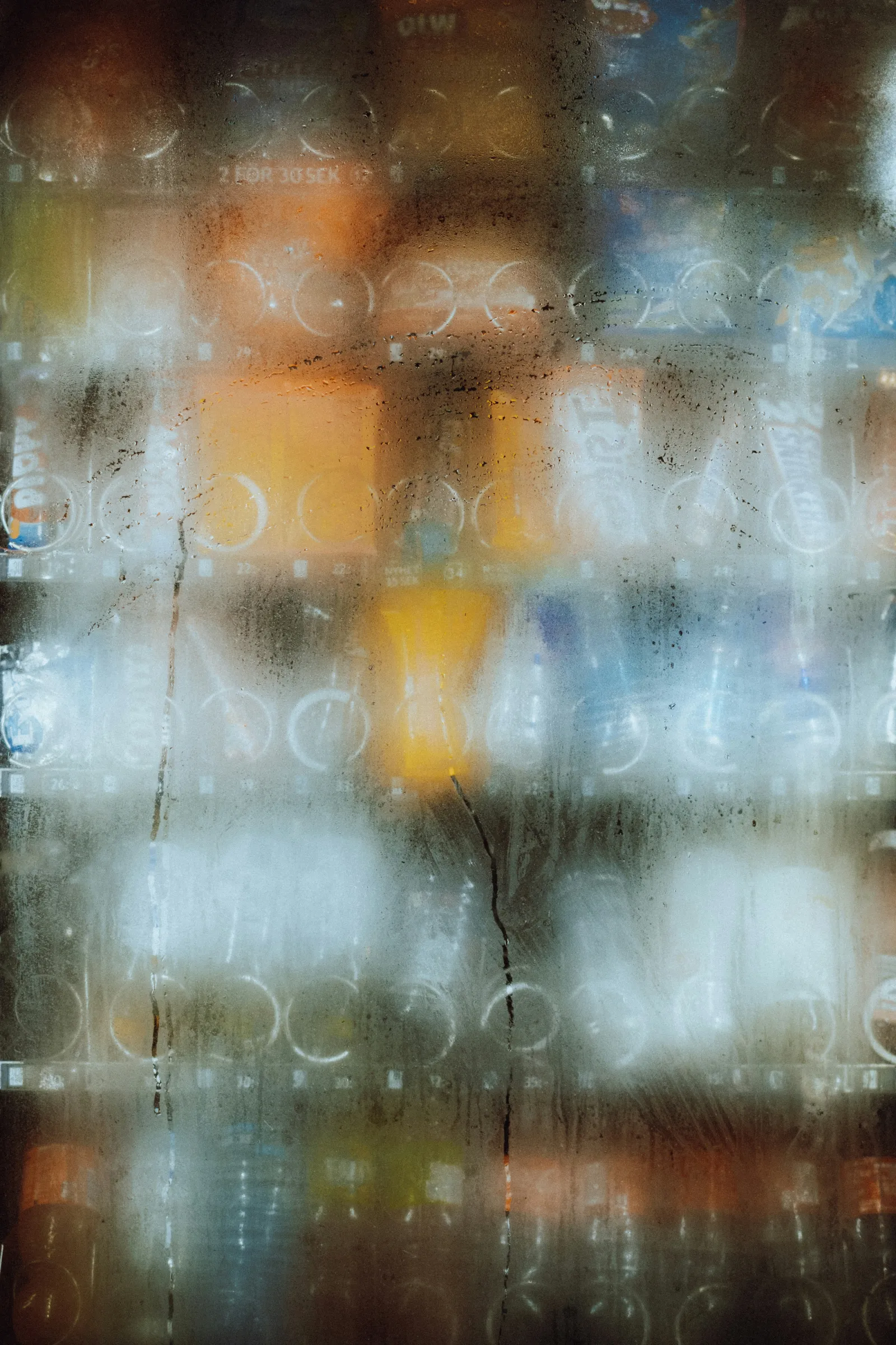 The misted glass of a vending machine. Photo by Fredrik Ohlander via Unsplash.