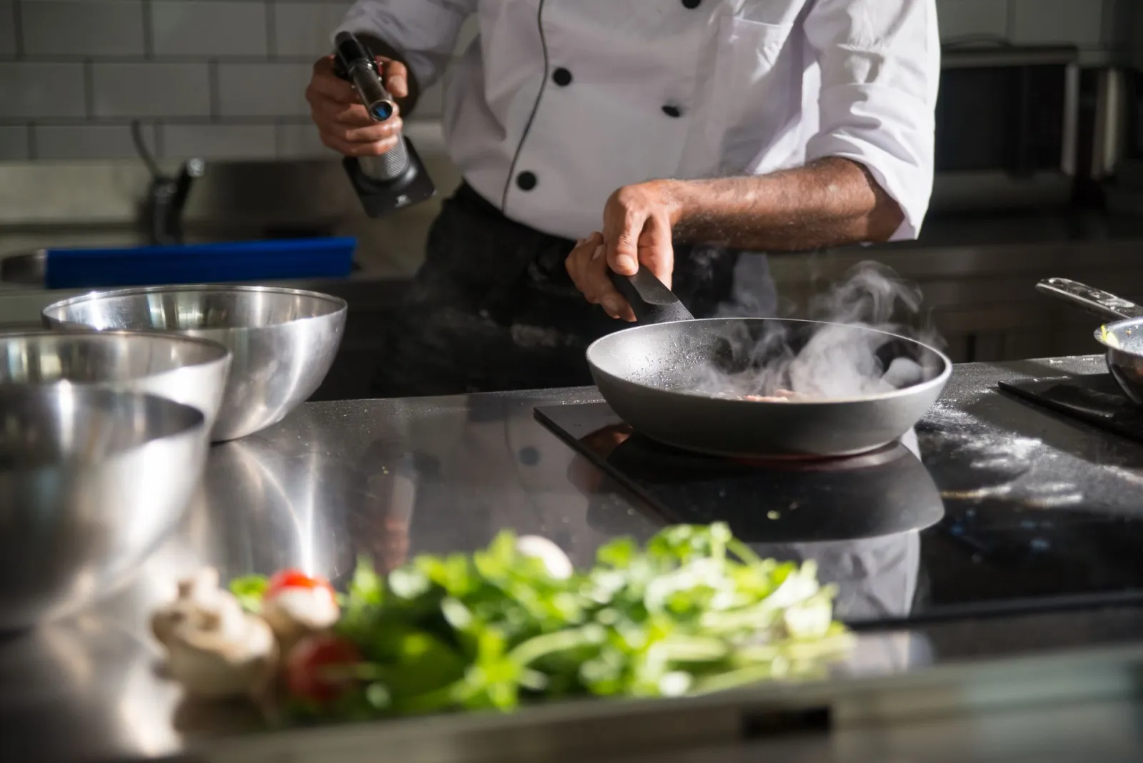 Chef with veg and pots. Credit: Kampus Production via Pexels