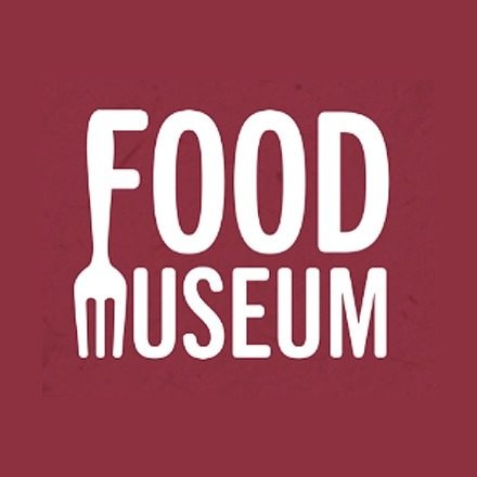 The logo for the Food Museum in which the words are stacked and the F in Food and M in Museum form a fork