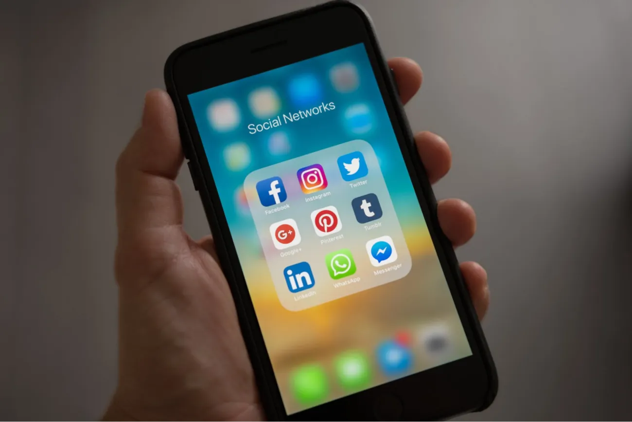 Image: Tracy Le Blanc, Person Holding Iphone Showing Social Networks Folder, Pexels, Pexels Licence