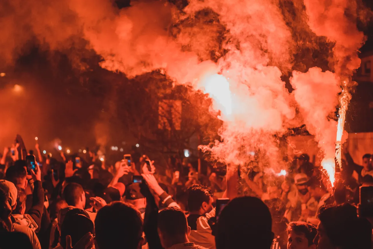 Image of a riot at night. Photo by Maurício Mascaro via Pexels.