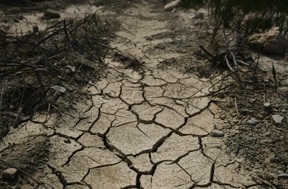Photo of cracked and dry soil in a field. Image by engin akyurt via Unsplash