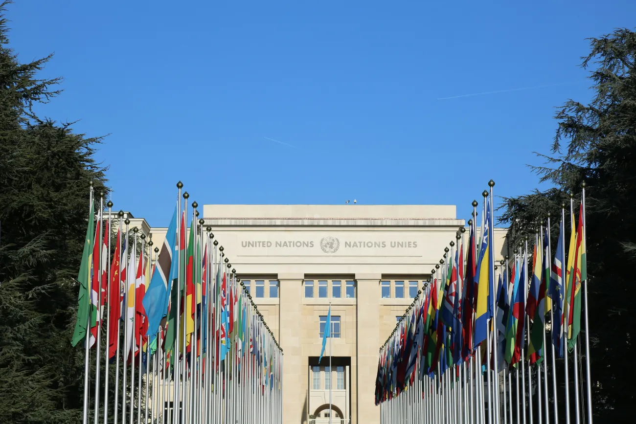 Image: UN building with member nation flags. Photo by Salya T via Unsplash