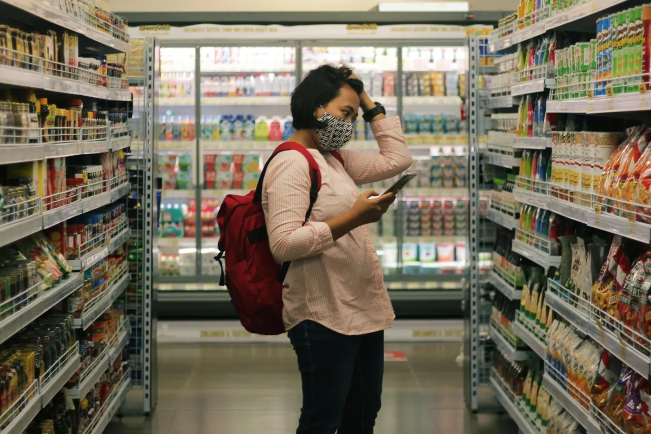 Photo of a woman shopping in a grocery store. Image by Viki Mohamad via Unsplash