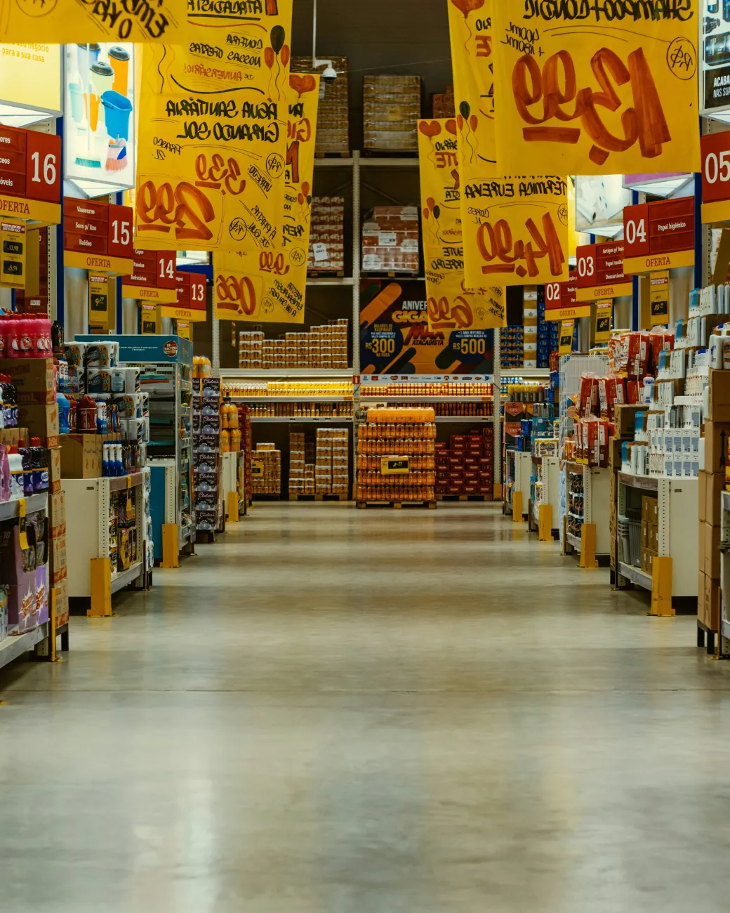 Shelves of food in a grocery store. Photo by Eduardo Soares via Unsplash.