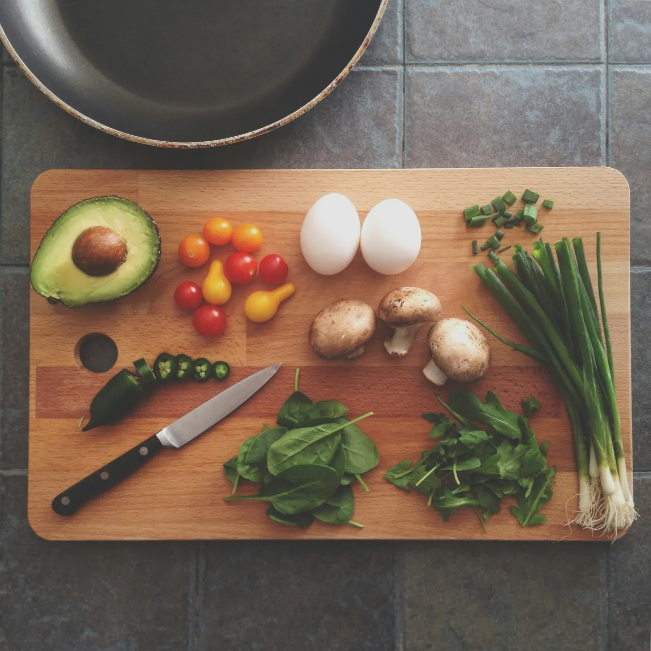 Ingredients on a cutting board. Photo by Katie Smith via Unsplash.