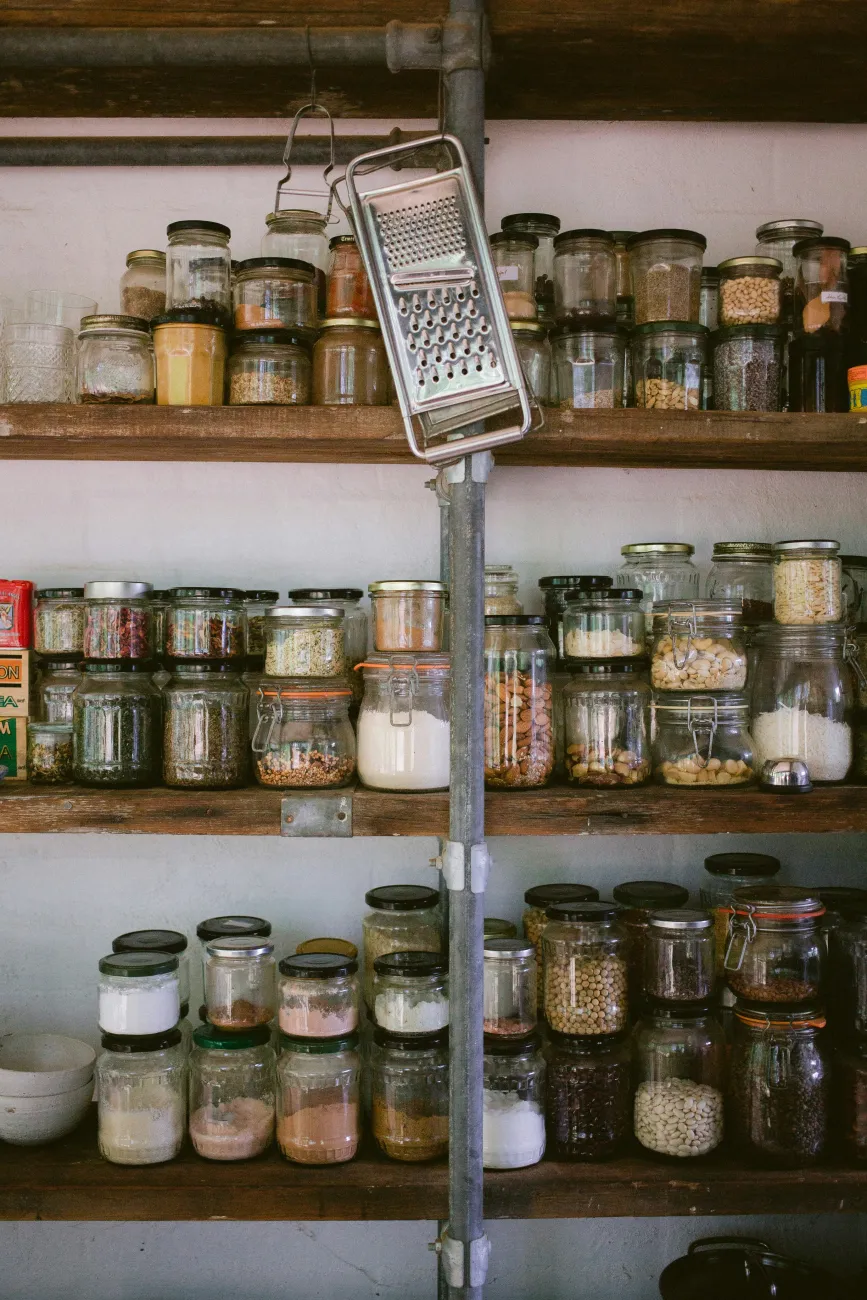 Jars of dry goods in a pantry. Photo by Luisa Brimble via Unsplash.