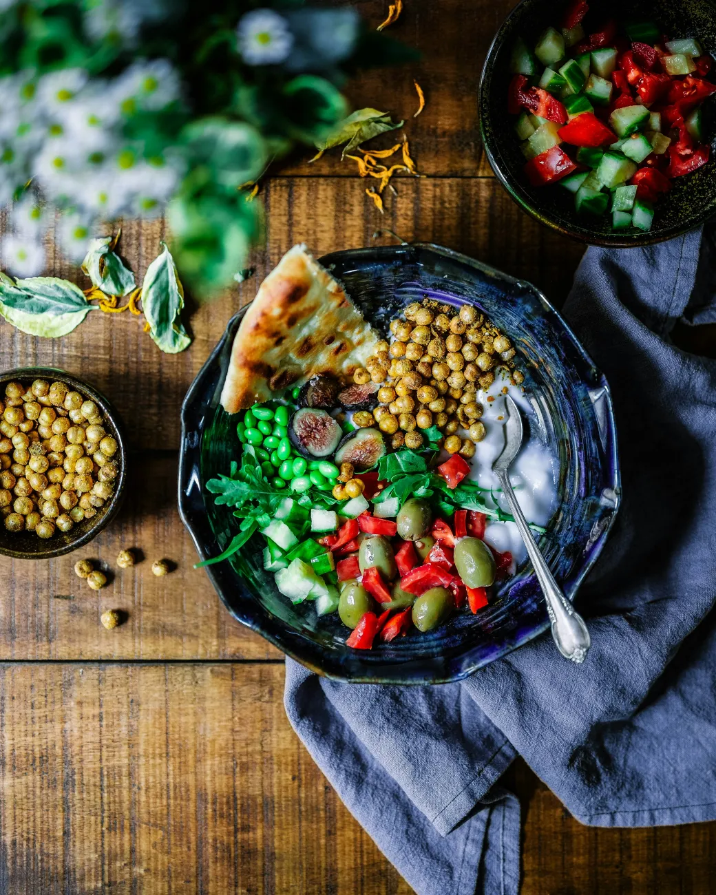 A meal with pita bread, veggies, and sauce. Photo by Odiseo Castrejon via Unsplash.