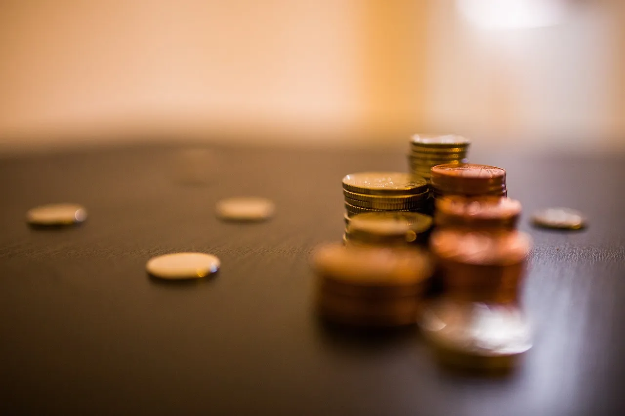  Stack of coins. Image by Lalmch from Pixabay