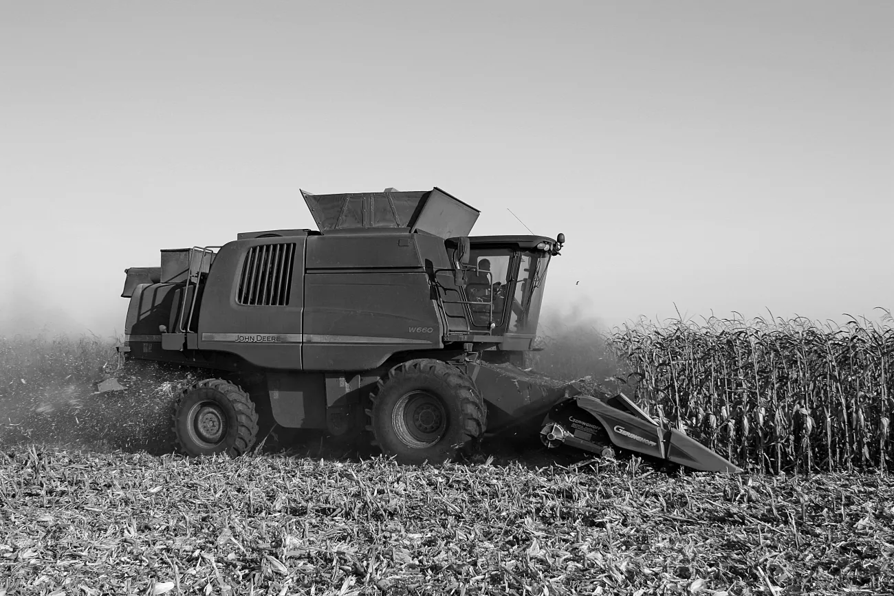 Photo of a combine harvester in black and white. Credit Alex Rusin via pexels