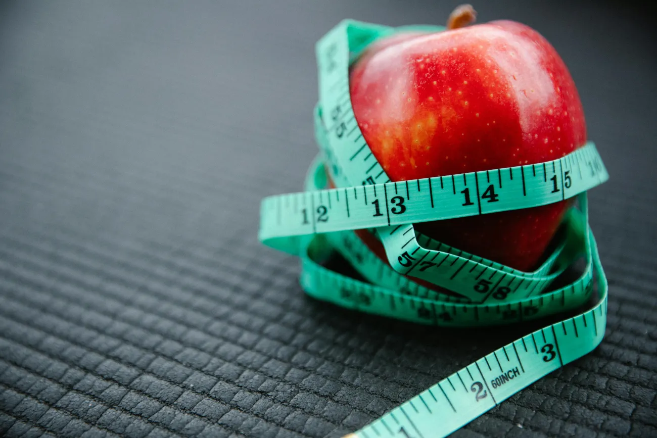 Photo of apple with tape measurer. Credit: Annushka Ahuja