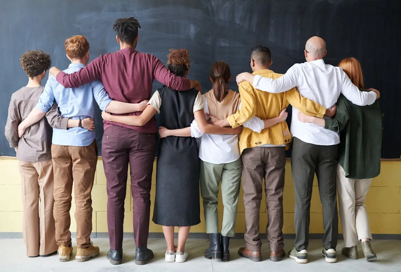 People standing with backs to camera. Credit Fauxels via Pexels. 