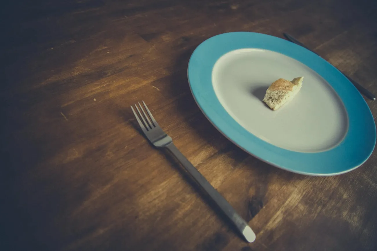 A plate with a tiny piece of food. Credit: Markus Spiske via Pexels