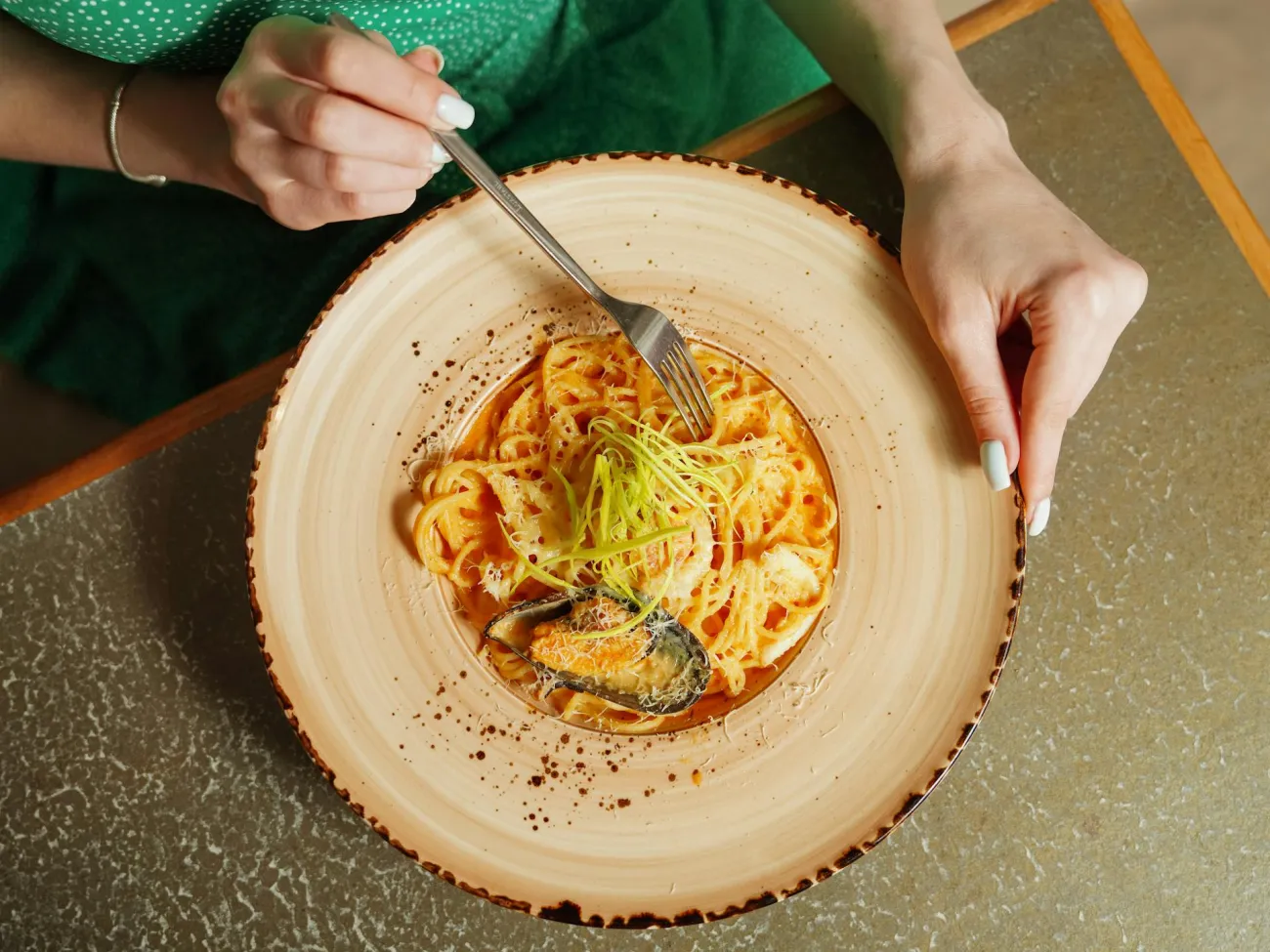 Plate of pasta with fork. Credit: Nadin Sh via Pexels