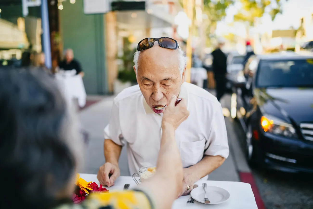 Man tasting food in the street. Credit RDNE Stock project via pexels