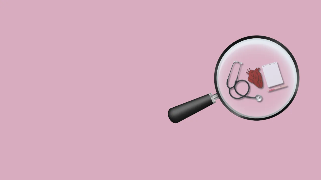 A magnifying glass hovers over some health-related items like a notebook, stethoscope and heart.