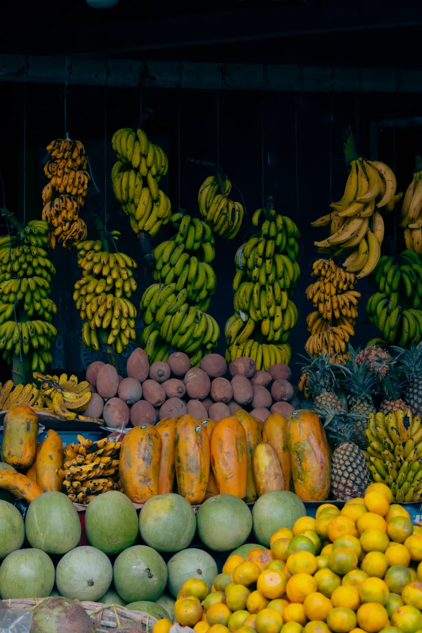 Stacks of fruit at a market stall. Photo by Kevin Serech on Unsplash.