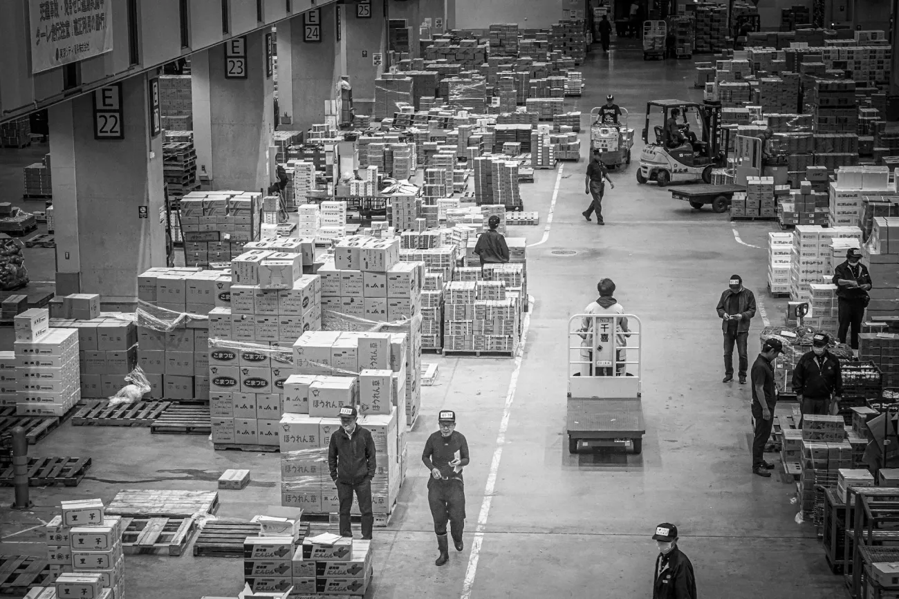 Black and white photo of food logistics in market. Credit:  Lawrence Lam via Pexels