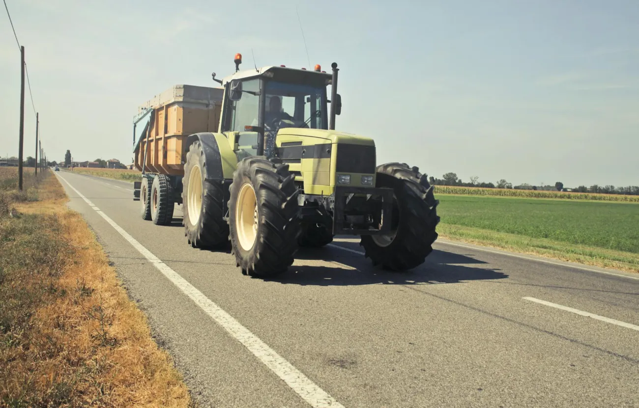 Tractor driving on road. Credit: Andrea Piacquadio via Pexels
