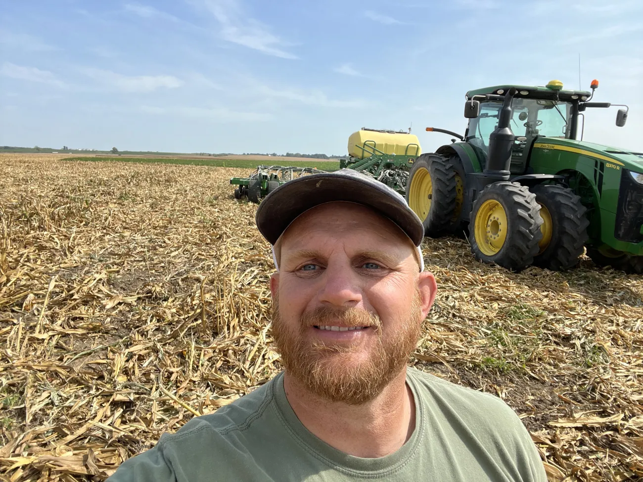 Ryan Britt headshot with tractor in background