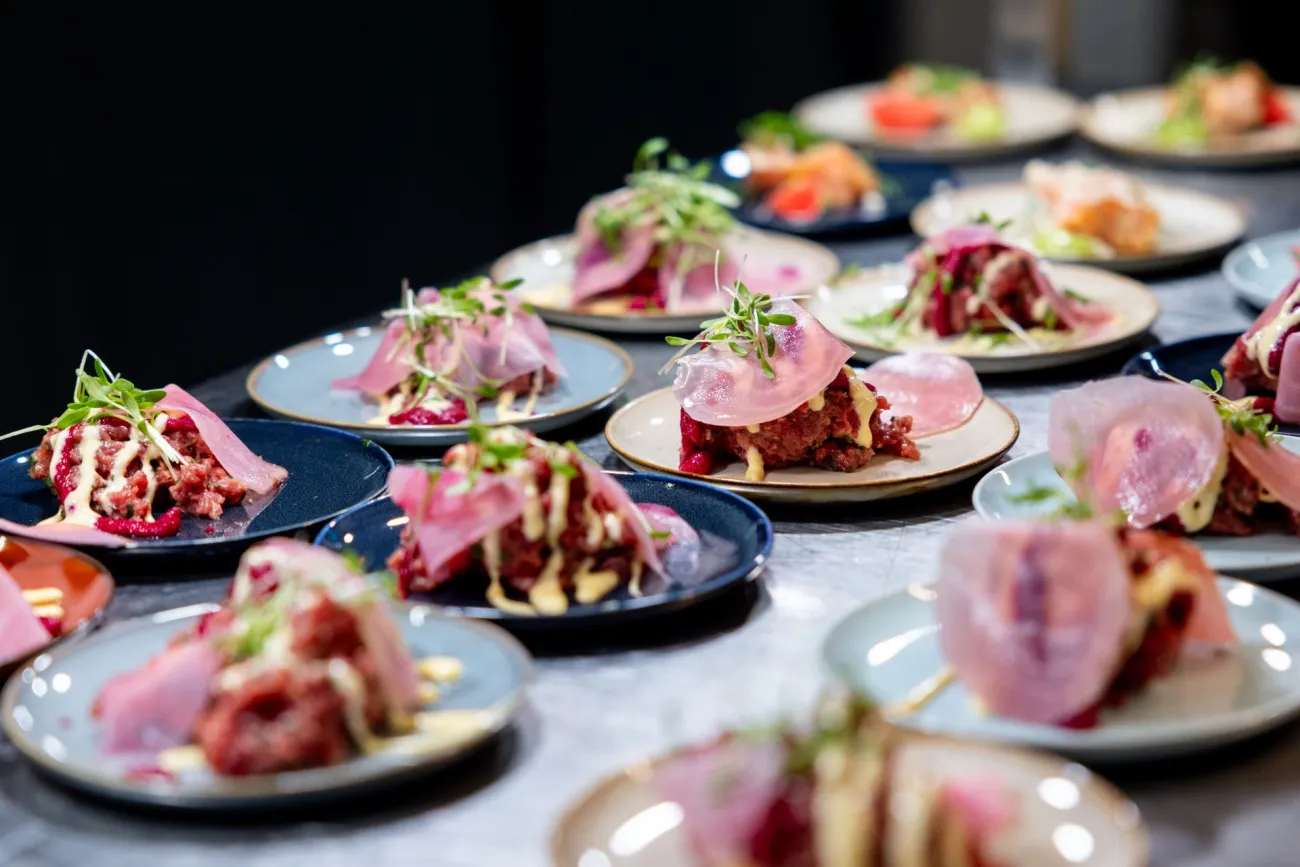 Plates of food lined up. Credit: Filipp Romanovski via Pexels