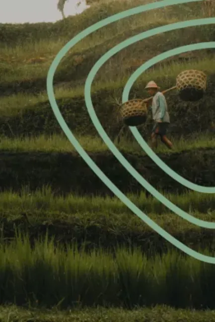 Image of a farmer carrying two baskets surrounded by the Food Systems Economic Commission symbol.