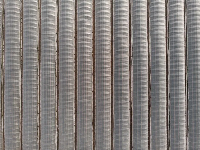Aerial view of rows of greenhouses