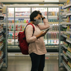 Photo of a woman shopping in a grocery store. Image by Viki Mohamad via Unsplash